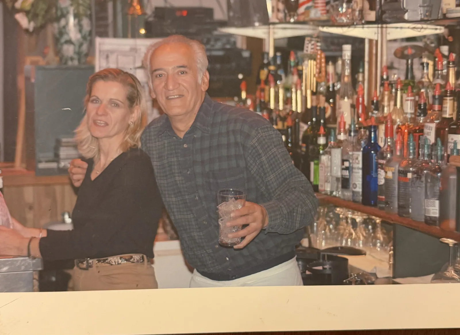 George Vlasidis and family behind the bar